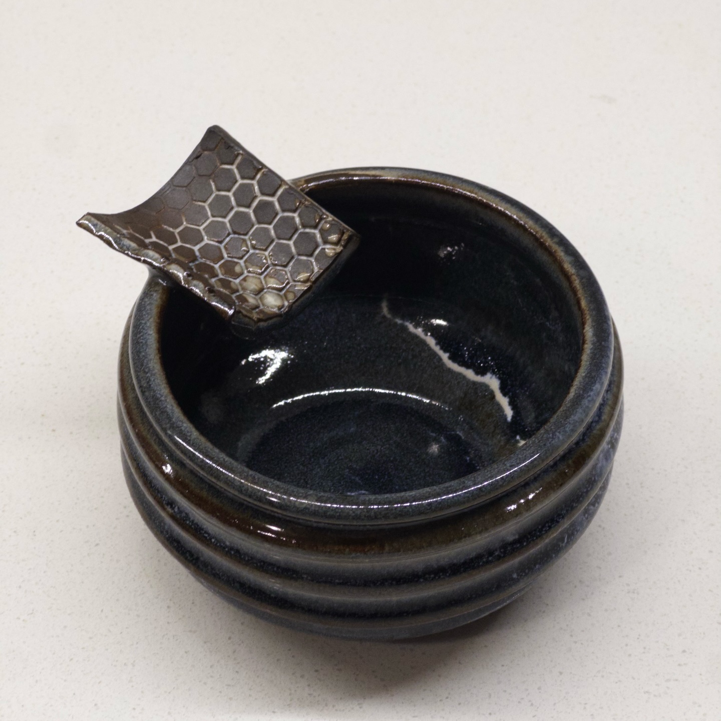 Ribbed incense holder with honeycomb tab, deep midnight glaze